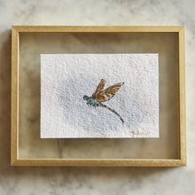 Load image into Gallery viewer, One of a kind artwork incorporating found dragonfly wing, gold leaf, watercolor paint, ink on archival cold press 5x7 watercolor paper, shown framed
